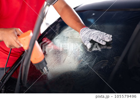 Car front windscreen film removal and tinting installation Car front windscreen film removal and tinting installation 105579496