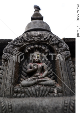 Stone statuette of sitting Buddha in Swayambhunath. Now destroyed after the earthquake that hit Kathmandu, Nepal 105579758