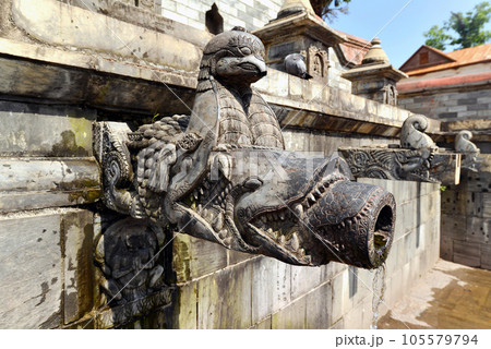Carved stone public fountain in Pashupatinath, Nepal Carved stone public fountain in Pashupatinath, Nepal 105579794