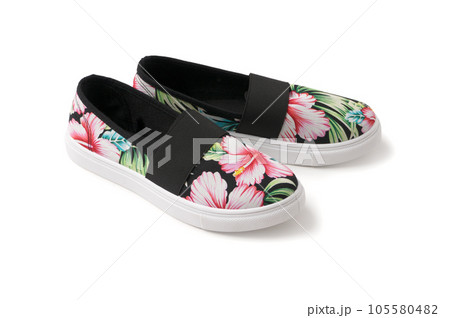 Casual summer women's textile loafers. A new pair of shoes on a white background Casual summer women's textile loafers. A new pair of shoes on a white background 105580482