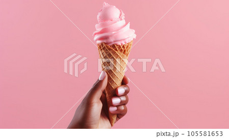 Hand-holding strawberry ice cream cone in pink faded pastel color Hand-holding strawberry ice cream cone in pink faded pastel color 105581653