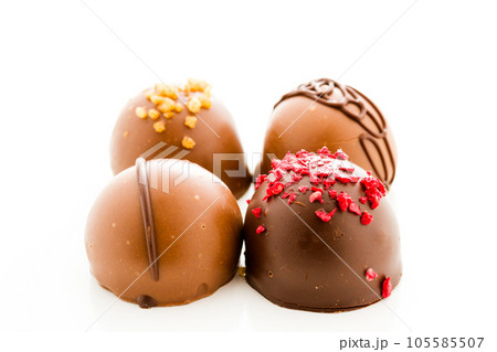 Assortedgourmet chocolate candies in different shapes and colors. Assortedgourmet chocolate candies in different shapes and colors. 105585507