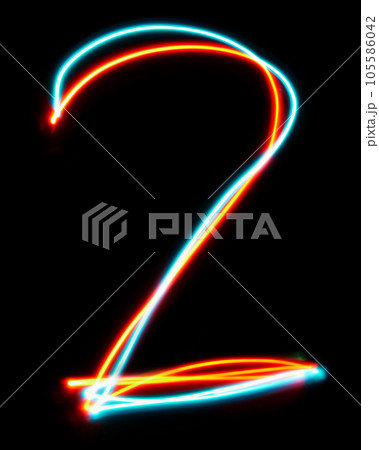 Number 2 of the alphabet made from neon sign. The blue red light image, long exposure with colored fairy lights, against a black background. 105586042