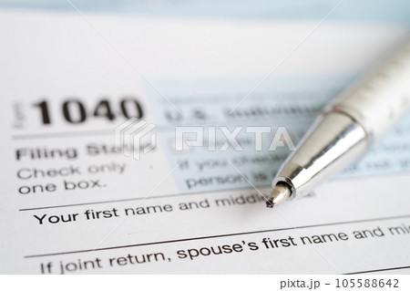 Tax form 1040 U.S. Individual Income Tax Return, business finance concept. Tax form 1040 U.S. Individual Income Tax Return, business finance concept. 105588642