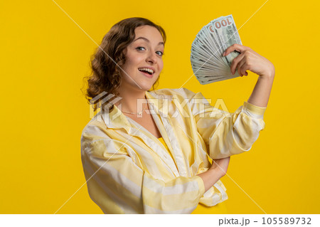 Rich pleased boss woman waving money dollar cash, success business career, lottery winner big income Rich pleased boss woman waving money dollar cash, success business career, lottery winner big income 105589732