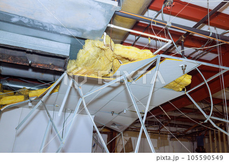 Reconstruction ceiling works interior buildings with dismantling of a old ceiling in construction complex 105590549