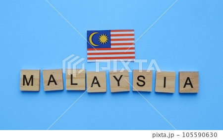August 31, Malaysia Independence Day, Malaysia National Day, flag of Malaysia, minimalistic banner with the inscription in wooden letters August 31, Malaysia Independence Day, Malaysia National Day, flag of Malaysia, minimalistic banner with the inscription in wooden letters 105590630