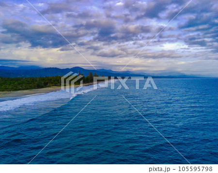 the beautiful Bali Beach in Blangpidie, South West Aceh, Indonesia with blue ocean against the blue sky shot with aerial drone. 105595798