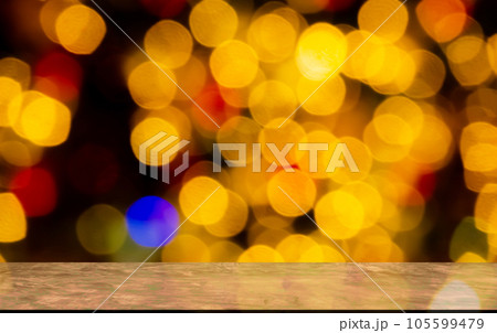 Blank Wooden Table with Orange Red Bokeh on Black Background,Golden Light Night Blur Circle Effect Sparkle,Card Poster,Empty Floor Counter for Autumn, Merry Christmas and Happy New Year 2023 Concept. 105599479