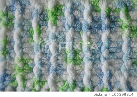 Blue and green Aran braid cable stitch knitting pattern background 105599814