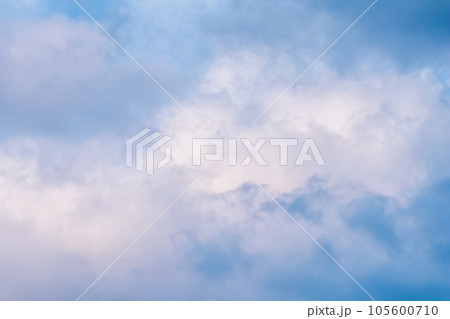Blue sky background with white and pink clouds at sunset. High quality photo 105600710