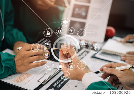 Medical team working on digital tablet healthcare doctor technology tablet using computer analyzed the results of medical reports, an online conference at the hospital. 105606926