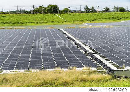 View of the floating Solar power system on the flood detention basin in Kaohsiung, Taiwan. View of the floating Solar power system on the flood detention basin in Kaohsiung, Taiwan. 105608269