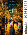 A men with umbrella in illuminated alley at rainy night, Tokyo 105610526