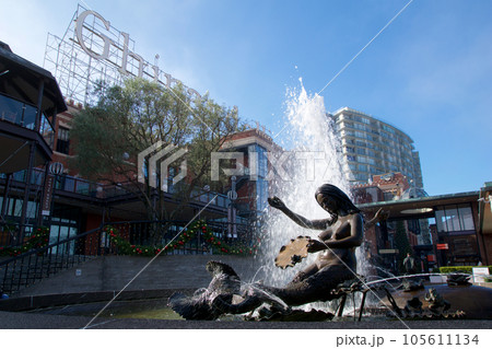 SAN FRANCISCO, CALIFORNIA, UNITED STATES - NOV 25th, 2018: Visitors in Ghirardelli Square with fountain.It's a famous landmark public square with shops and restaurants of San Francisco SAN FRANCISCO, CALIFORNIA, UNITED STATES - NOV 25th, 2018: Visitors in Ghirardelli Square with fountain.It's a famous landmark public square with shops and restaurants of San Francisco 105611134