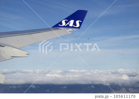 KOPENHAGEN, DENMARK - 24 NOV 2018: View from the aircraft cabin to the wing shortly after take-off 105611170
