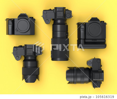 Top view of monochrome designer workspace and photography gear on yellow Top view of monochrome designer workspace and photography gear on yellow 105616319