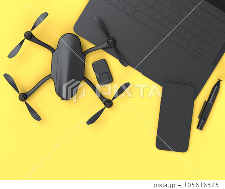Top view of monochrome designer workspace and photography gear on yellow Top view of monochrome designer workspace and photography gear on yellow 105616325