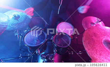 Drummer Playing on Drums Assembly. 105616411