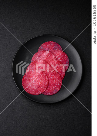 Delicious smoked salami sausage with salt, spices and herbs 105616869