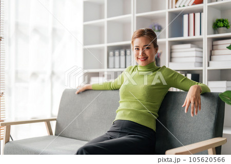 Asian woman beautiful sit back and relax in the living room 105620566