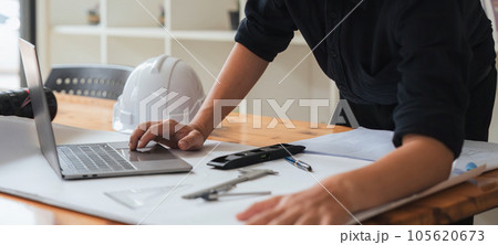 Architect engineer design working on blueprint planning concept 105620673