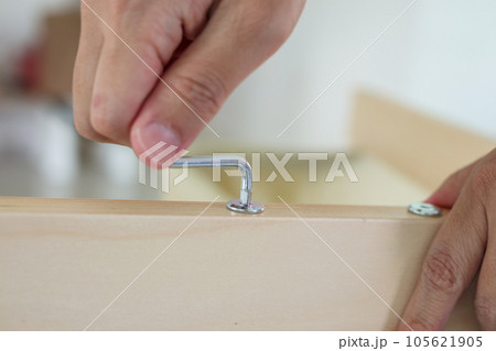 Assembly wooden furniture at home using screw allen 105621905