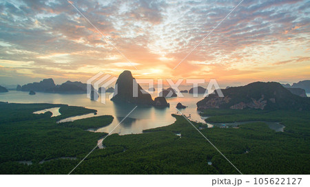 aerial view Amazing light of nature cloudscape sky above Samed Nang Chee Phang Nga archipelago.  Imagine a fantasy bright red sky at sunrise from a bird's eye view. tropical landscape background. aerial view Amazing light of nature cloudscape sky above Samed Nang Chee Phang Nga archipelago.  Imagine a fantasy bright red sky at sunrise from a bird's eye view. tropical landscape background. 105622127