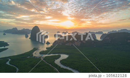 aerial view Amazing light of nature cloudscape sky above Samed Nang Chee Phang Nga archipelago. Imagine a fantasy bright red sky at sunrise from a bird's eye view. tropical landscape background. aerial view Amazing light of nature cloudscape sky above Samed Nang Chee Phang Nga archipelago. Imagine a fantasy bright red sky at sunrise from a bird's eye view. tropical landscape background. 105622128
