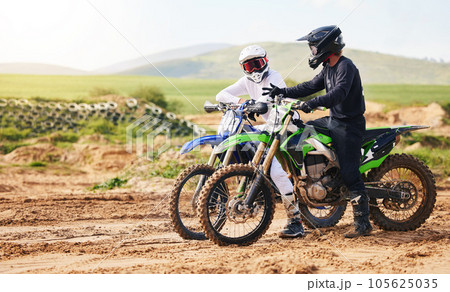 Sports, friends and men with motorcycle in countryside for fun, hobby and stunt training, practice or freedom. Off road on dirt, motorbike and biker people in nature for adrenaline, challenge or race Sports, friends and men with motorcycle in countryside for fun, hobby and stunt training, practice or freedom. Off road on dirt, motorbike and biker people in nature for adrenaline, challenge or race 105625035