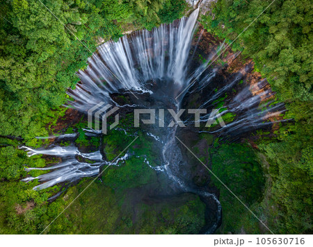 Aerial top view from above of Tumpak Sewu ,also known as Coban Sewu, 120m high waterfall in Malang regency, East Java, Indonesia 105630716