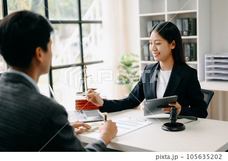 business people and lawyers discussing contract papers sitting at the table. Concepts of law, advice, legal services. in morning light business people and lawyers discussing contract papers sitting at the table. Concepts of law, advice, legal services. in morning light 105635202