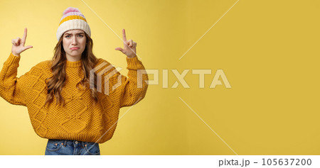 Upset whining complaining displeased cute young immature girl raise hands pointing up crying jealous regret wanna buy cool product have no money, standing sad sobbing yellow background 105637200