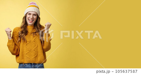 Yes lucky me. Satsified accompllished attractive celebrating young woman winning lottery feeling awesome clench raised fists victory dance say yeah smiling winner triumphing yellow background Yes lucky me. Satsified accompllished attractive celebrating young woman winning lottery feeling awesome clench raised fists victory dance say yeah smiling winner triumphing yellow background 105637587