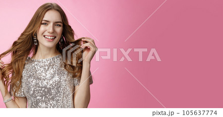 Attractive stylish confident european woman playing curly hairstyle get dressed rock party wearing glittering shiny blouse smiling broadly happily, self-assured she queen, standing pink background 105637774