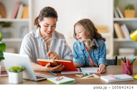 Girl doing homework or online education. Girl doing homework or online education. 105641414
