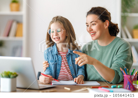 Girl doing homework or online education. Girl doing homework or online education. 105641415