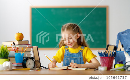 Kid is learning in class Kid is learning in class 105641737