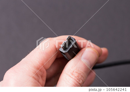 USB 3.0 cable on a black background close-up. USB 3.0 cable on a black background close-up. 105642241