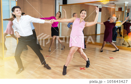 young woman with partner dance paso doble 105643427