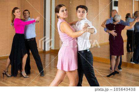 Young pair practicing ballroom dance in dance studio 105643438
