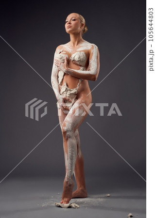 Living sculpture of a woman praying to heaven in the studio 105644803