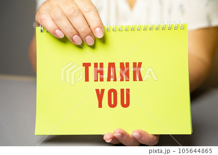 Thank you on notes in female hands. Expressing gratitude, acknowledgment or appreciation concept. Gratitude and appreciation. Feedback 105644865