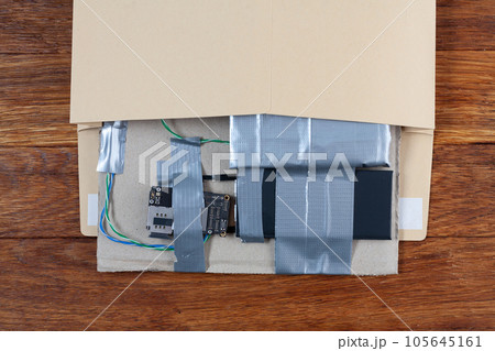 Mail bomb IED - Improvised Explosive Device with c4 and cell phone module in envelope Mail bomb IED - Improvised Explosive Device with c4 and cell phone module in envelope 105645161
