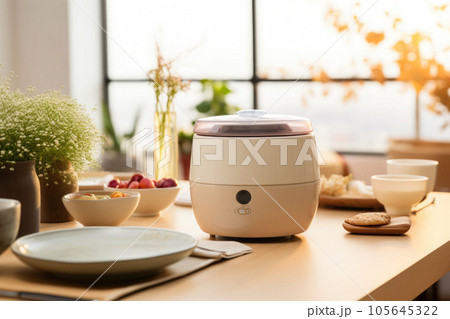 A minimalist bright kitchen with a rice cooker and dishes on top of the dining table. Generative AI 105645322