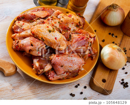Chicken wings pickled for grilling 105648129