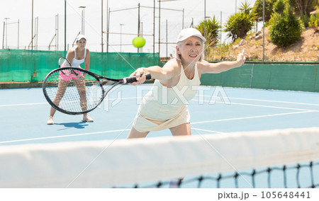 Senior woman plays tennis Senior woman plays tennis 105648441