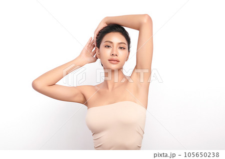Beautiful Young woman lifting hands up to show off clean and hygienic armpits or underarms on white background, Smooth armpit cleanliness and protection concept Beautiful Young woman lifting hands up to show off clean and hygienic armpits or underarms on white background, Smooth armpit cleanliness and protection concept 105650238