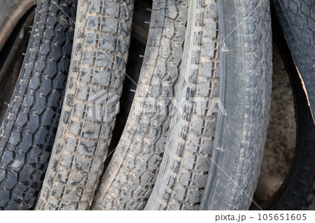 Old used car, bicycle and motorcycle tires in a pile Old used car, bicycle and motorcycle tires in a pile 105651605