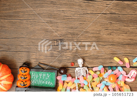Happy Halloween day with ghost candies, pumpkin,  bowl and decorative. Trick or Threat, Hello October, fall autumn, Festive, party and holiday concept 105651723